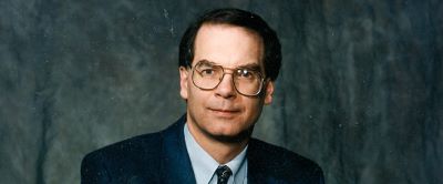 professional photo of man with glasses and suit